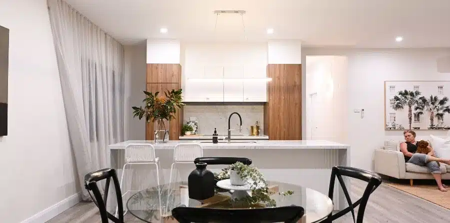 modern kitchen renovation with island bench, white cabinets, and open-plan design