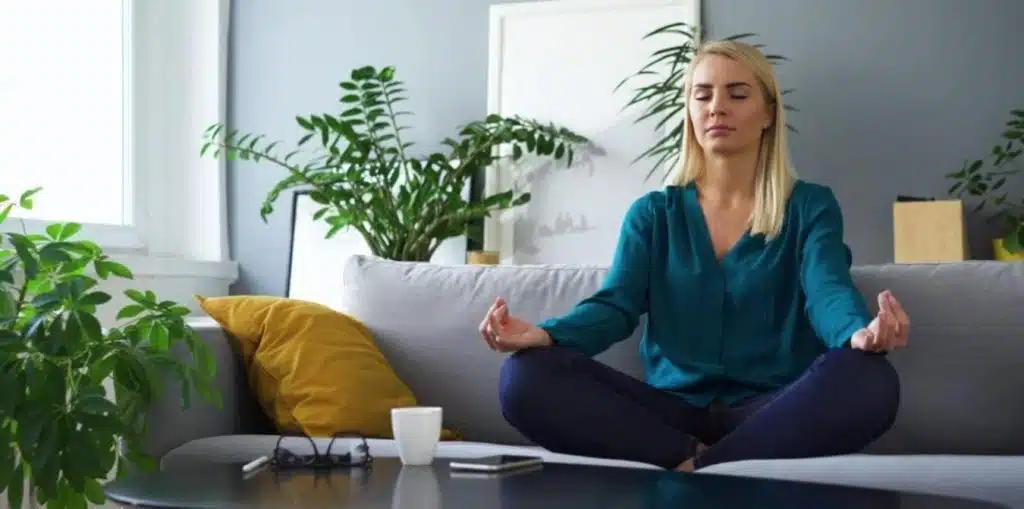 woman meditating at home developing mindset for renovating for profit