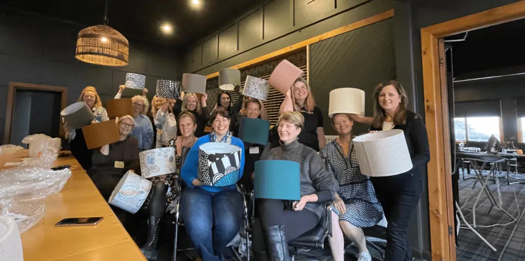 women over 50 learning renovating skills at workshop