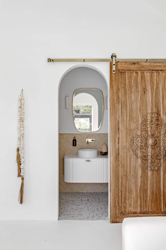 Elegant bathroom design with timber accents and modern coastal style.