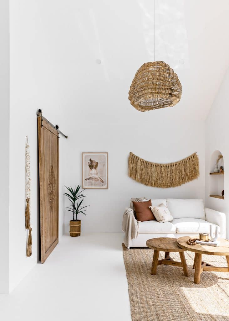 Boho coastal living room styled for Airbnb or holiday rental interiors.