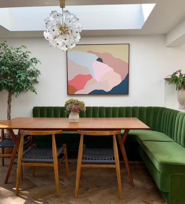 green velvet banquette seating – mid-century modern dining area