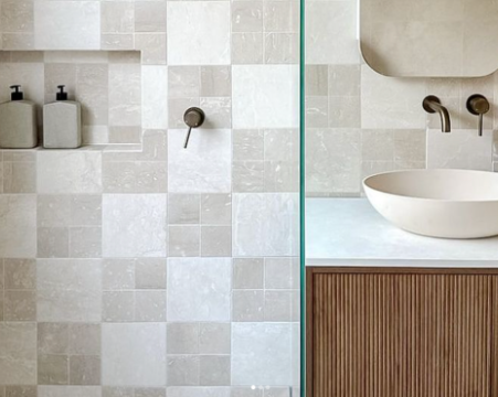 Bathroom renovation with neutral tiles and timber vanity for modern design