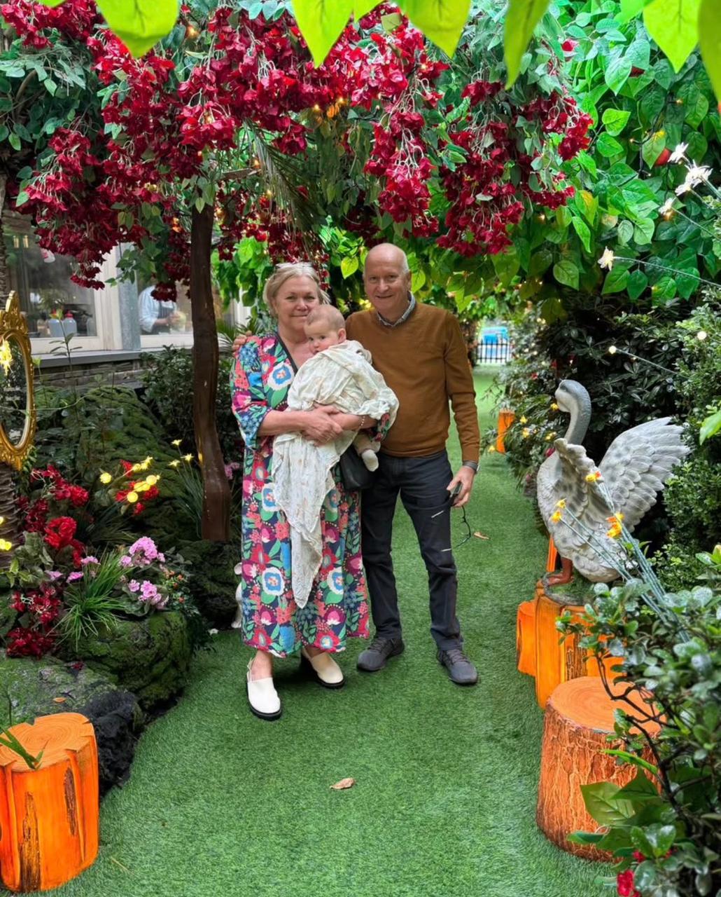 Grandmother renovating for income and impact, enjoying family time in a garden setting – The School of Renovating