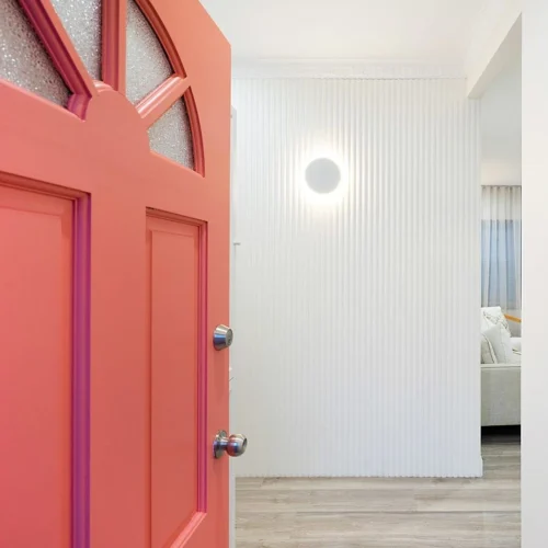 DIY front door makeover with coral paint and bright entryway design